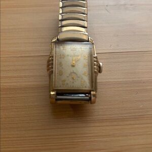 Vintage Bulova. Dial shows Patina. Works as good as it did 75 years ago.